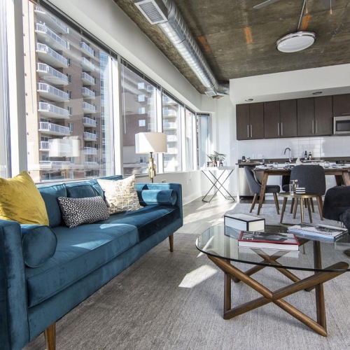 a living room with a blue couch