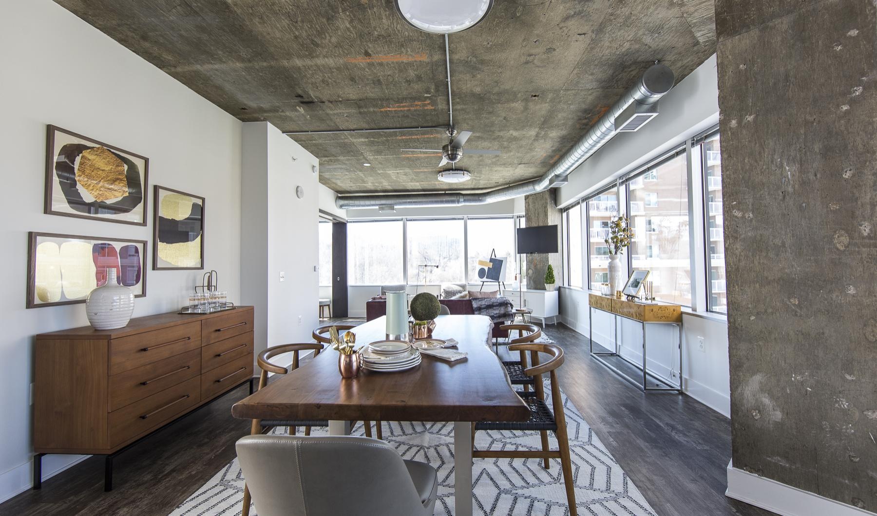 a dining room with a table and chairs