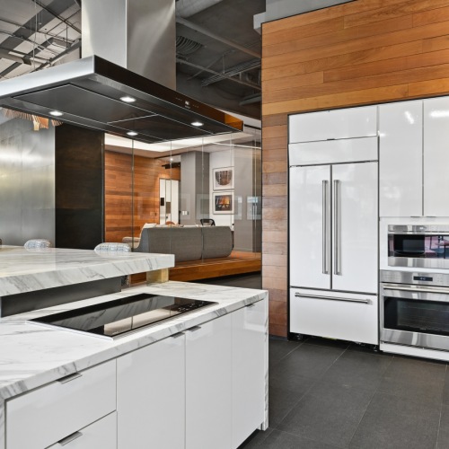Resident Kitchen with quartz countertops, stove, oven, refrigerator, and large sink